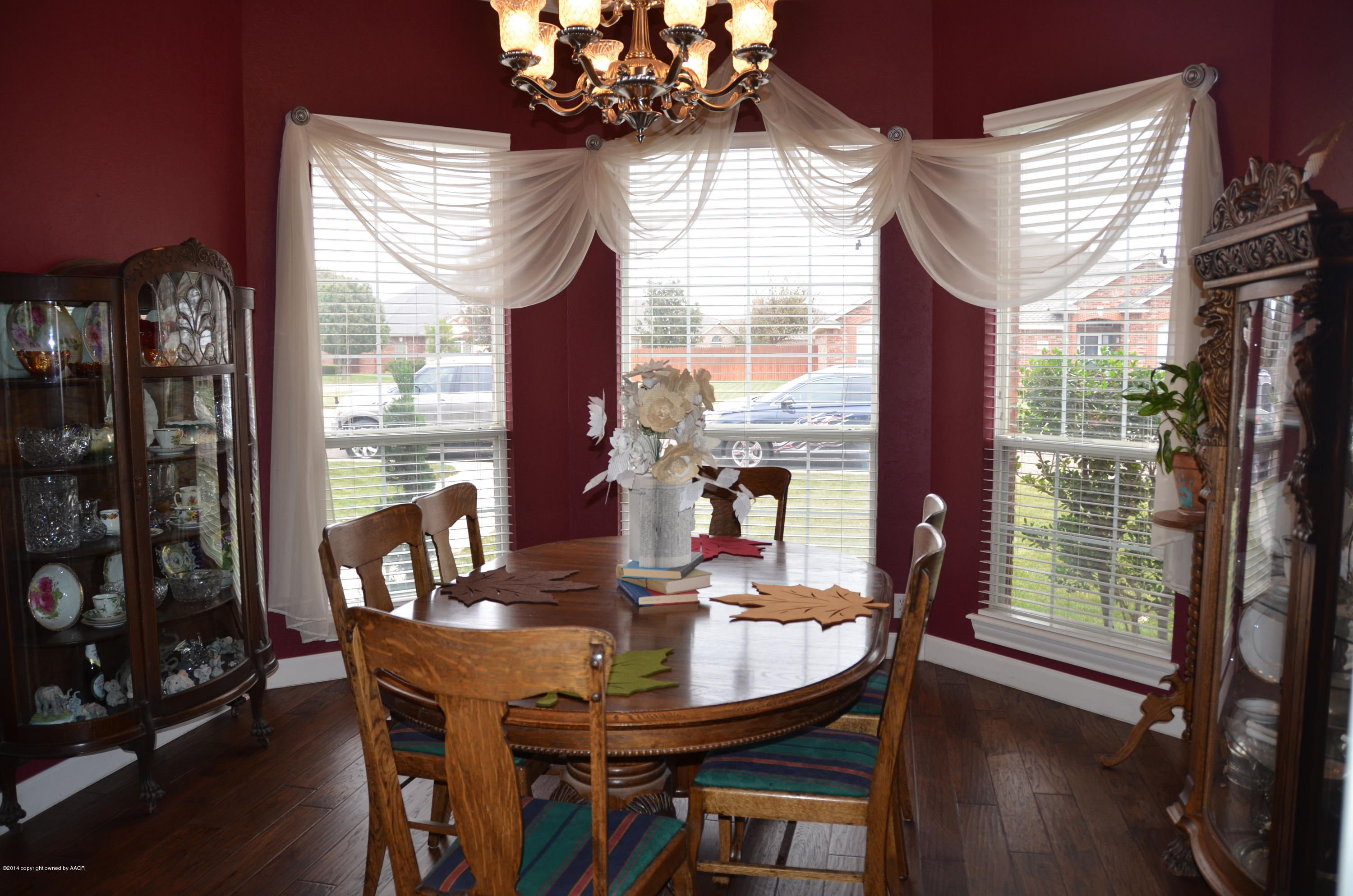 6613 Rally Road Amarillo, TX 79119 - Photo 9 of 29 a view of a dining room with furniture window and wooden floor