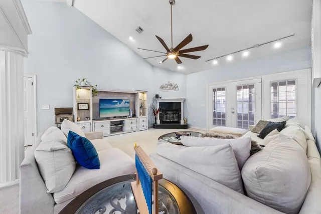 a kitchen with stainless steel appliances granite countertop a sink and a refrigerator