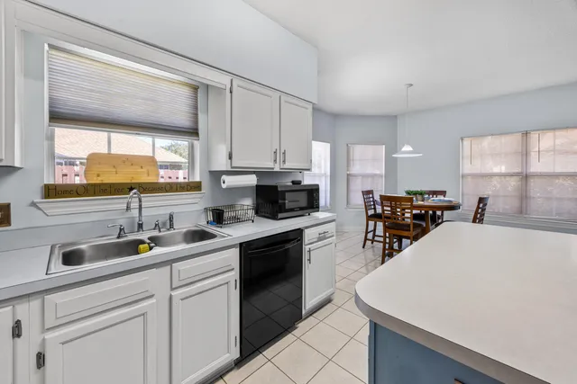 a bathroom with a sink mirror vanity and toilet