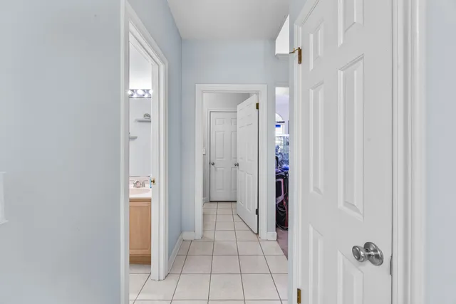 a bedroom with a bed and a shower curtain