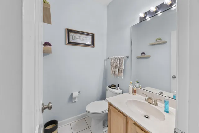 a bathroom with a sink vanity and a mirror