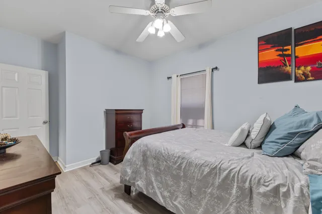 a large spacious bathroom with a tub a double vanity sink a mirror and a shower