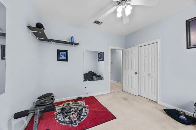 a spacious bathroom with a tub shower and window