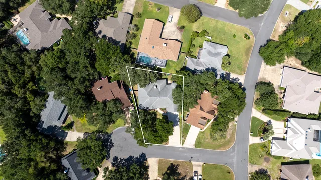 an aerial view of a residential houses with outdoor space