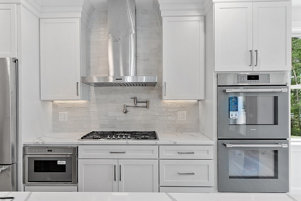 5 Barnard Hill Road Boylston, MA 01505 - Photo 11 of 37 a kitchen with granite countertop white cabinets and white appliances