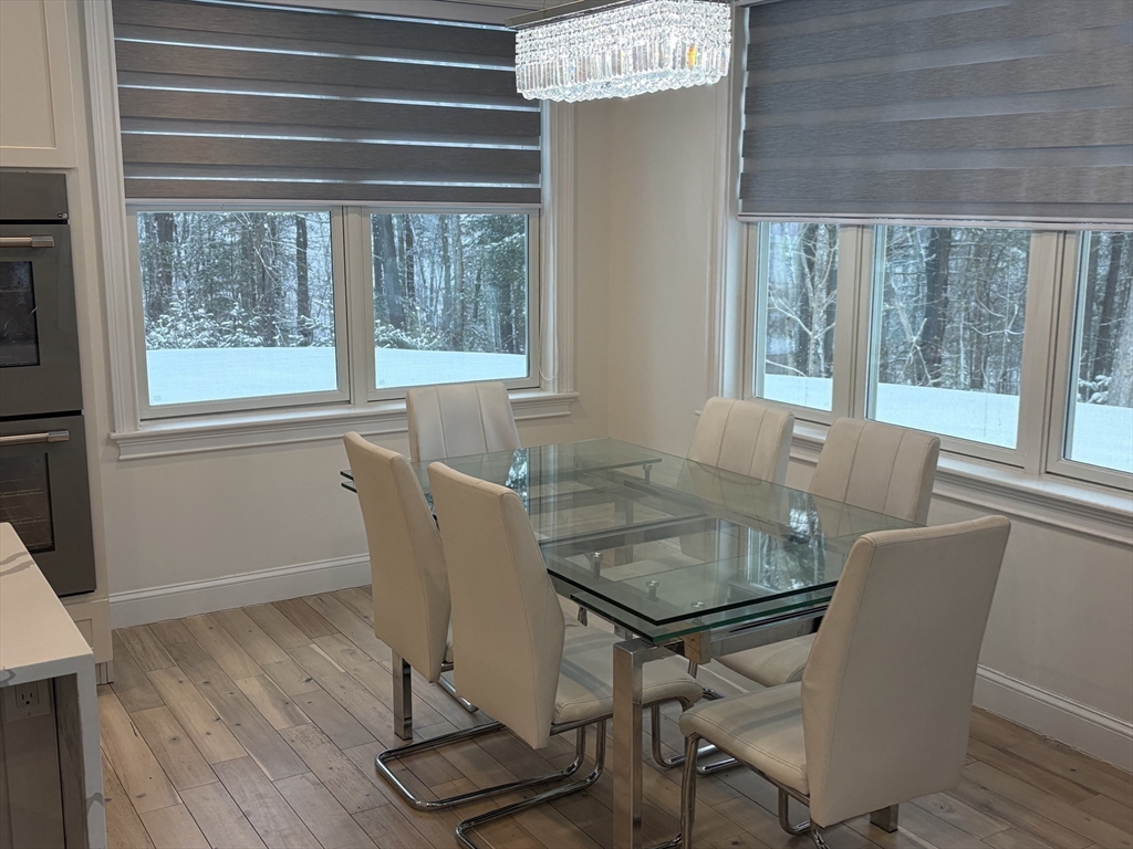 5 Barnard Hill Road Boylston, MA 01505 - Photo 15 of 37 a view of a dining room with furniture and wooden floor