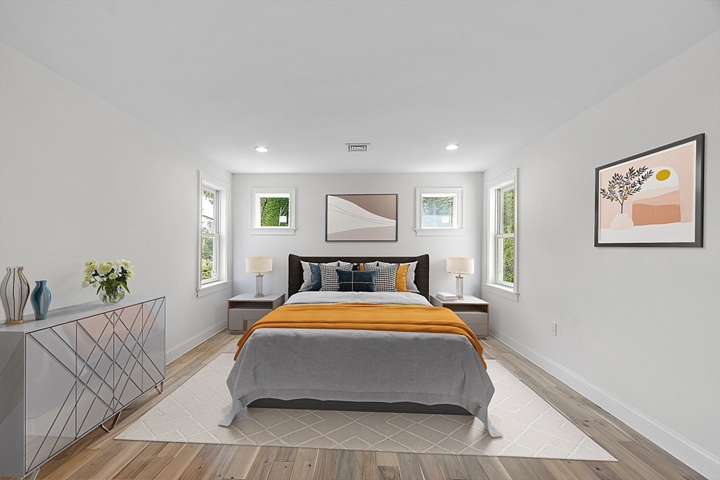 5 Barnard Hill Road Boylston, MA 01505 - Photo 24 of 37 a bedroom with a large bed and a chandelier