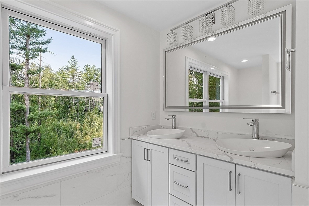 5 Barnard Hill Road Boylston, MA 01505 - Photo 26 of 37 a bathroom with a granite countertop sink mirror and window