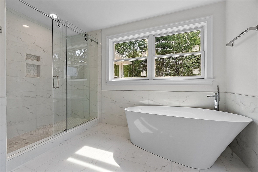5 Barnard Hill Road Boylston, MA 01505 - Photo 27 of 37 a bath tub sitting in a bathroom next to a window