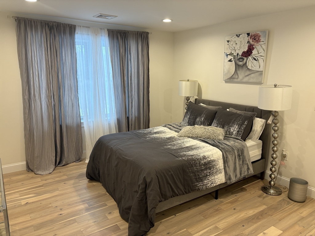 5 Barnard Hill Road Boylston, MA 01505 - Photo 30 of 37 a bedroom with a bed and painting on the wall