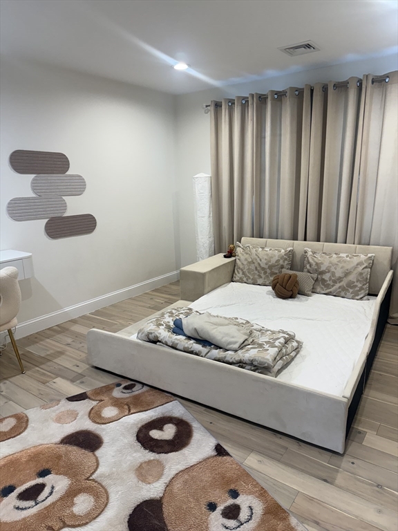 5 Barnard Hill Road Boylston, MA 01505 - Photo 33 of 37 a bedroom with a bed and wooden floor