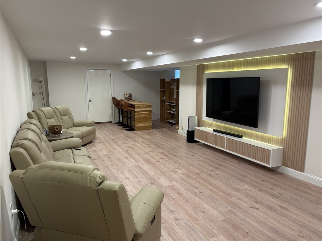 5 Barnard Hill Road Boylston, MA 01505 - Photo 35 of 37 a living room with furniture gym equipment and a flat screen tv