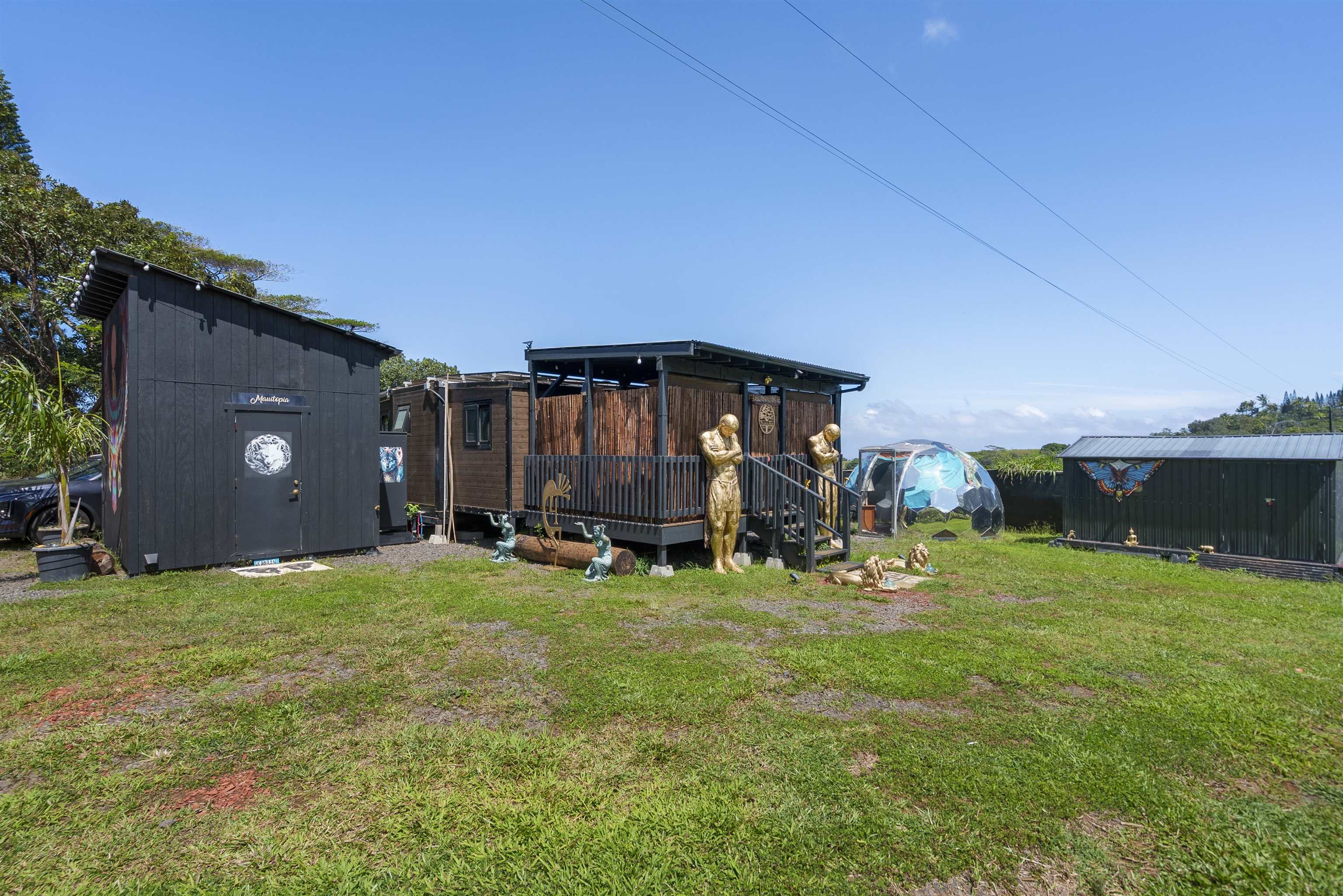 3980 Hana Highway Haiku, HI 96708 - Photo 18 of 33 a view of a house with backyard and sitting area