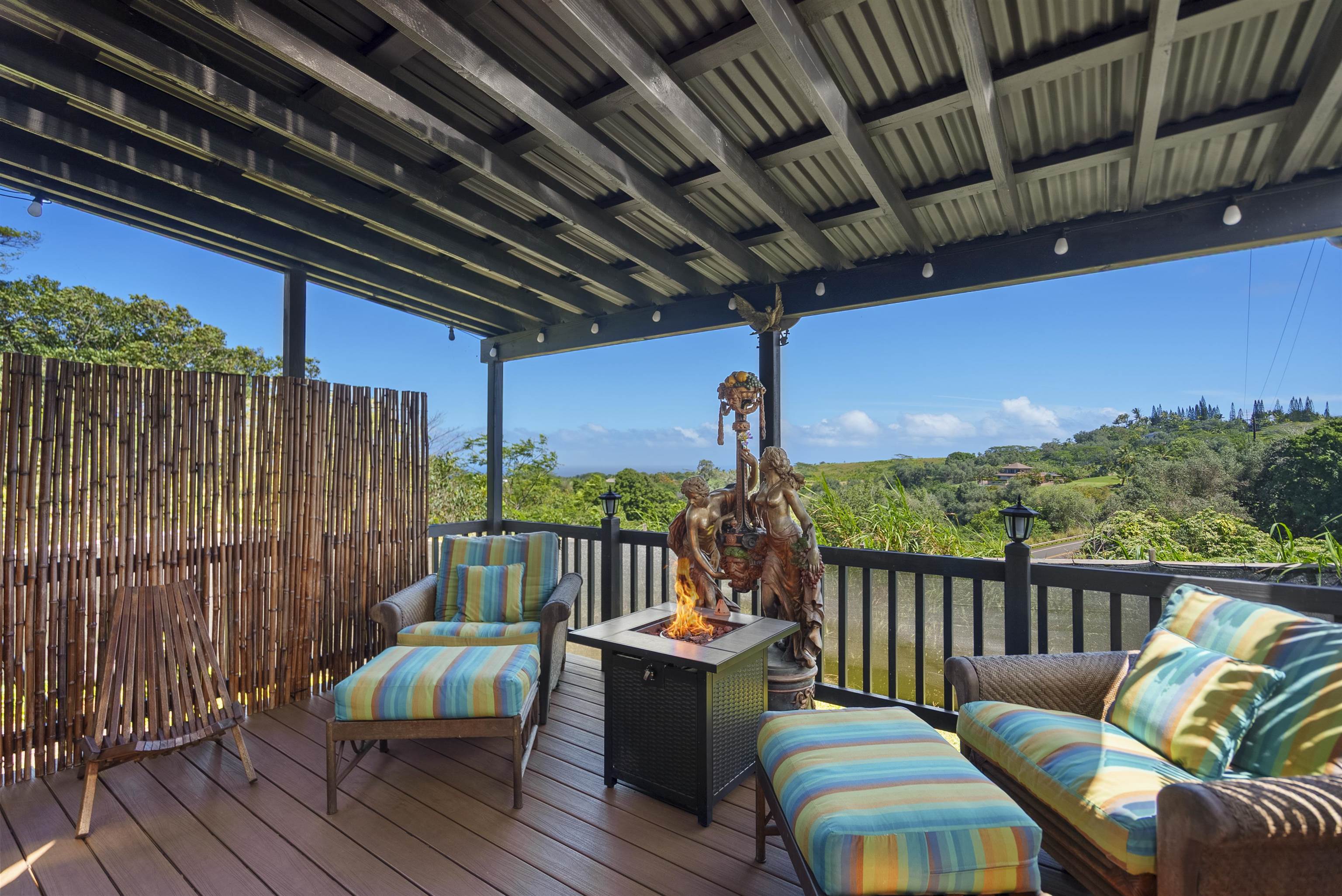 3980 Hana Highway Haiku, HI 96708 - Photo 6 of 33 a balcony with furniture and wooden floor
