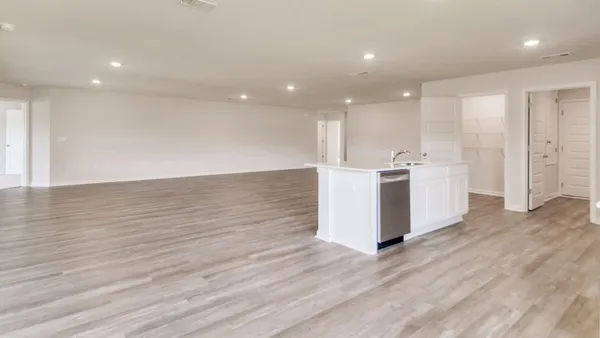 a view of a kitchen with wooden floor