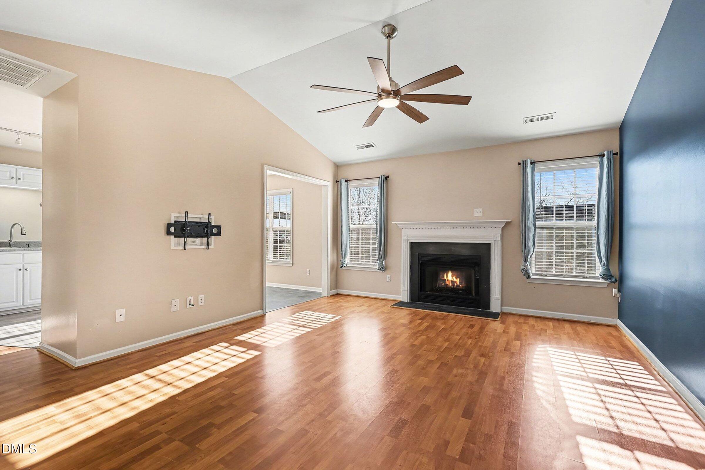 1005 Tesh Court High Point, NC 27265 - Photo 11 of 34 a view of a livingroom with wooden floor and a fireplace