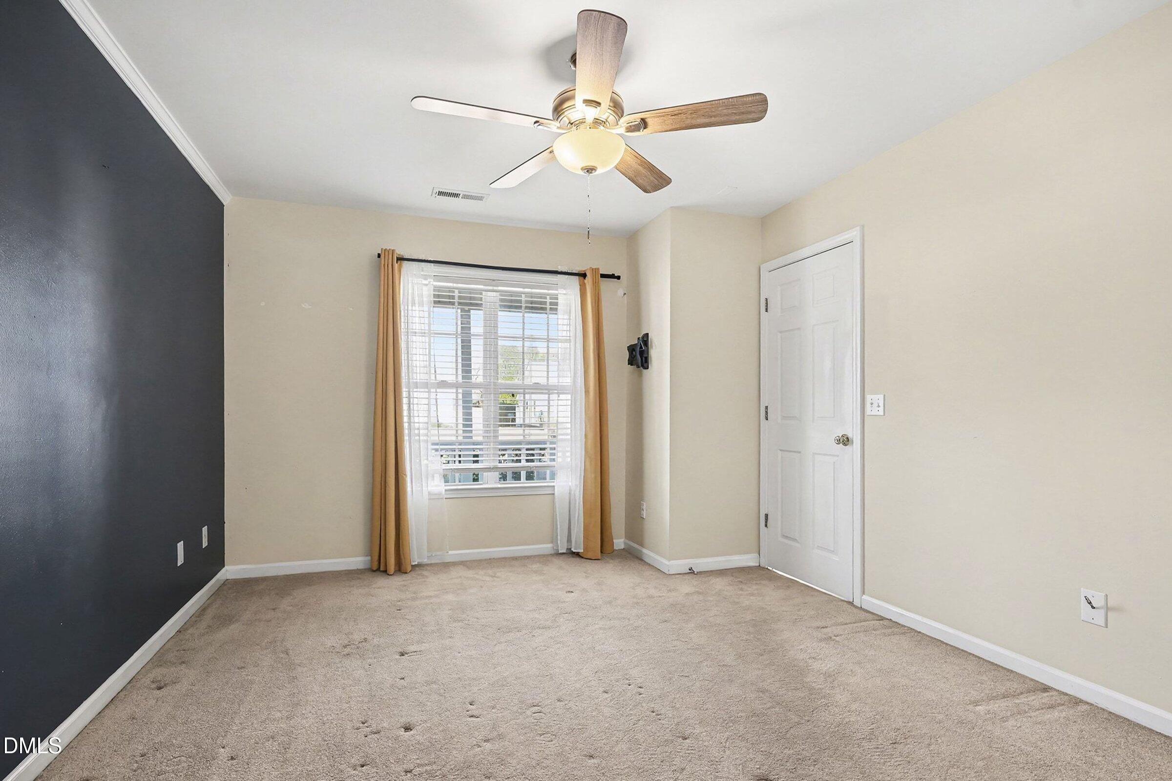 1005 Tesh Court High Point, NC 27265 - Photo 18 of 34 an empty room with windows and fan