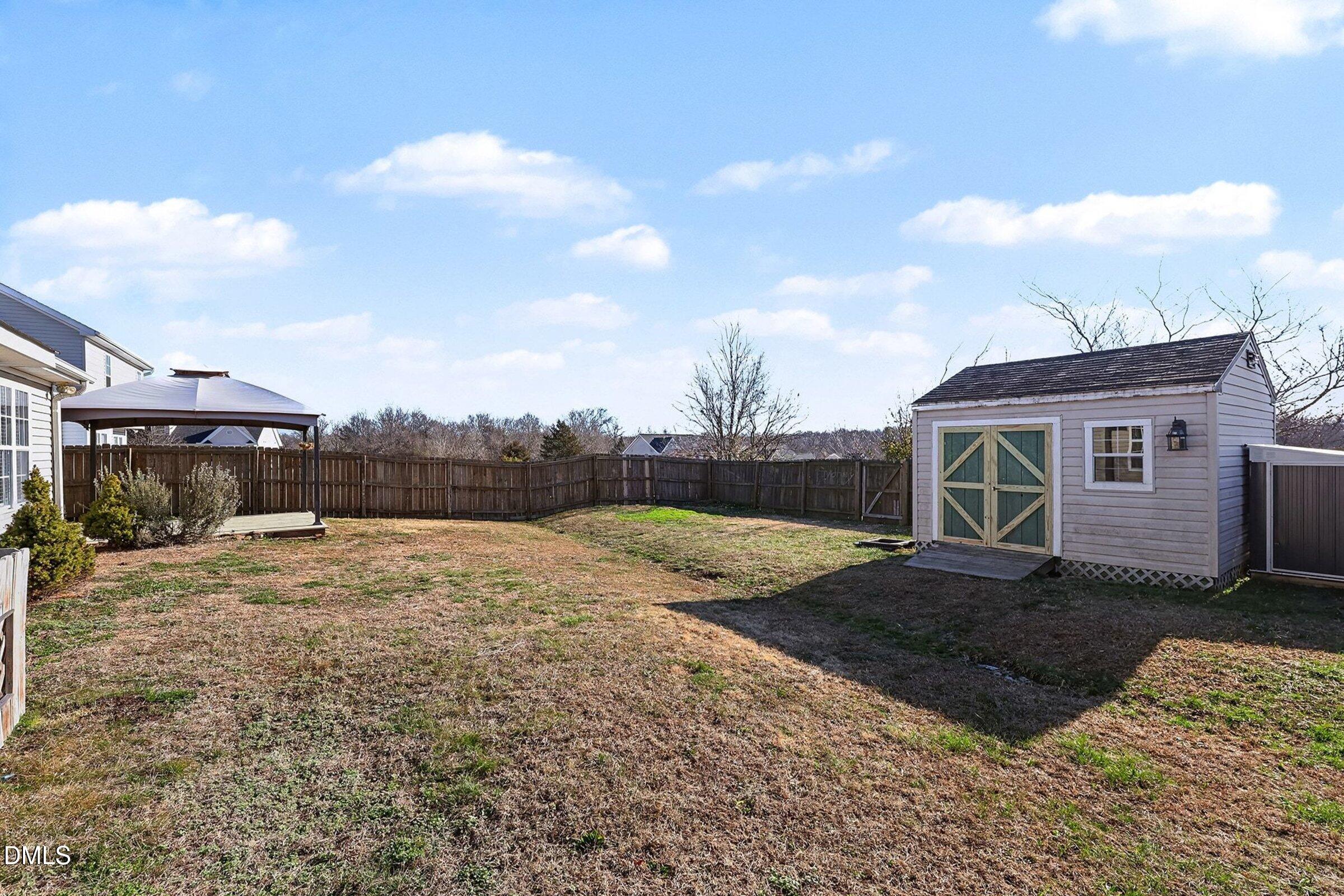 1005 Tesh Court High Point, NC 27265 - Photo 30 of 34 a view of a house with a backyard
