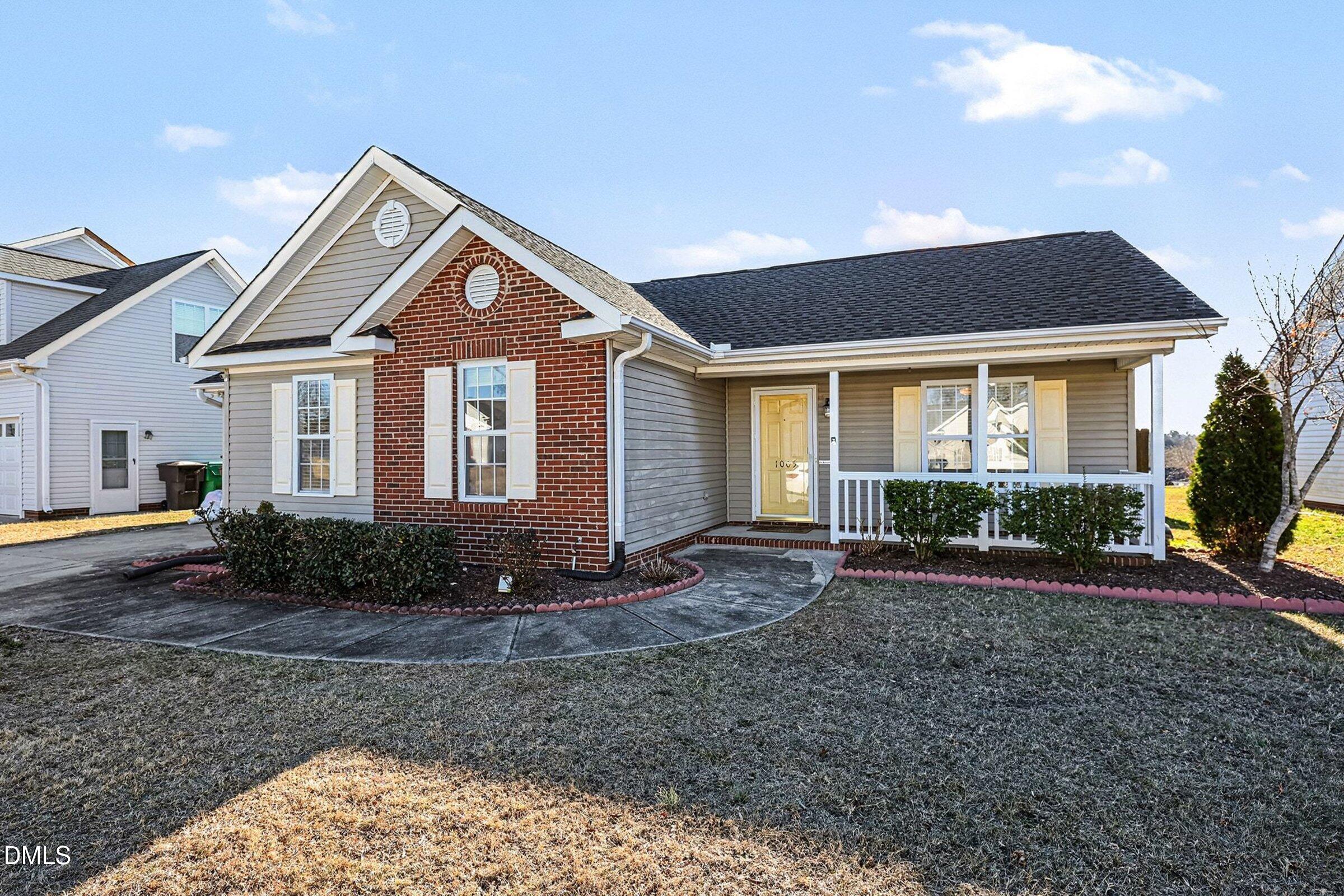 1005 Tesh Court High Point, NC 27265 - Photo 31 of 34 a front view of a house with garden