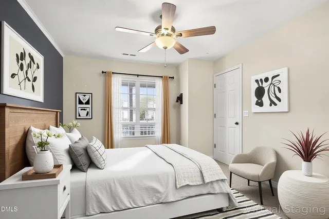 a bedroom with a bed and ceiling fan