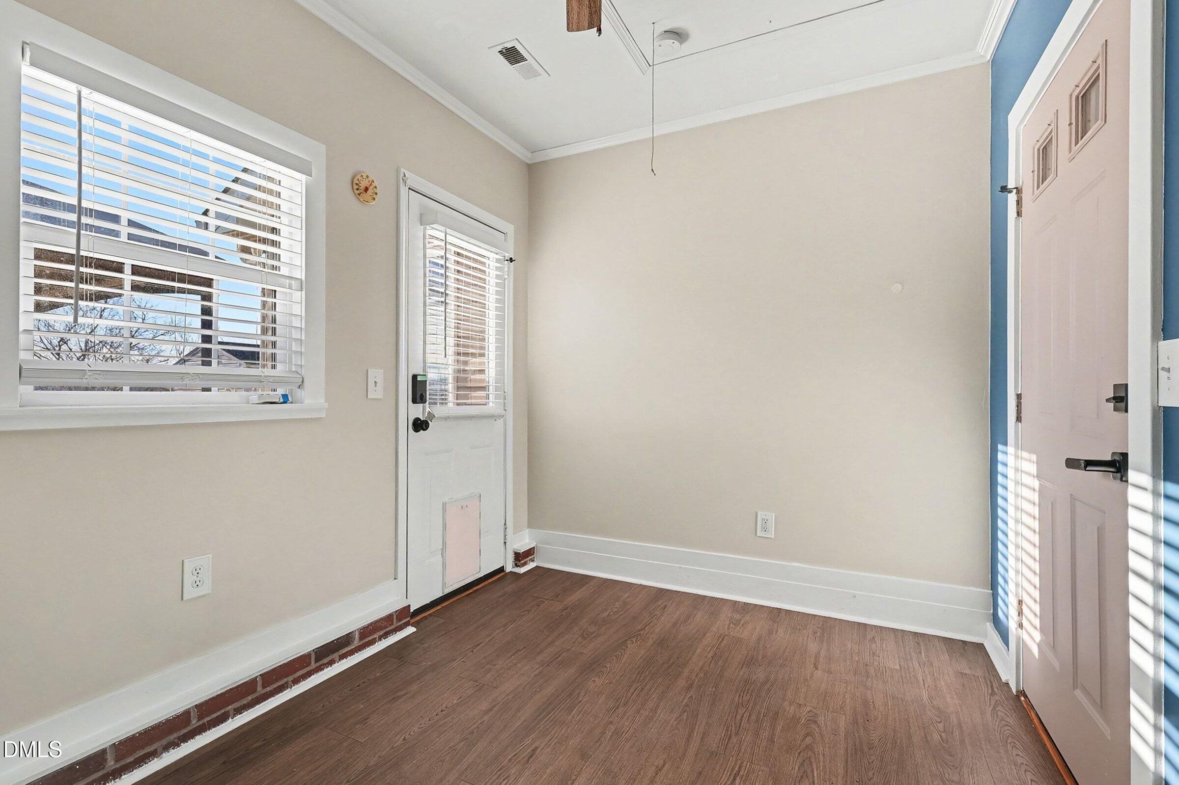 1005 Tesh Court High Point, NC 27265 - Photo 8 of 34 an empty room with wooden floor and windows