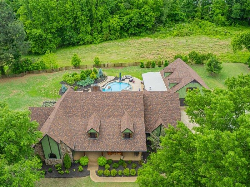 8104 Jack Bond Road Arlington, TN 38002 - Photo 3 of 40 an aerial view of a house with a yard and trees