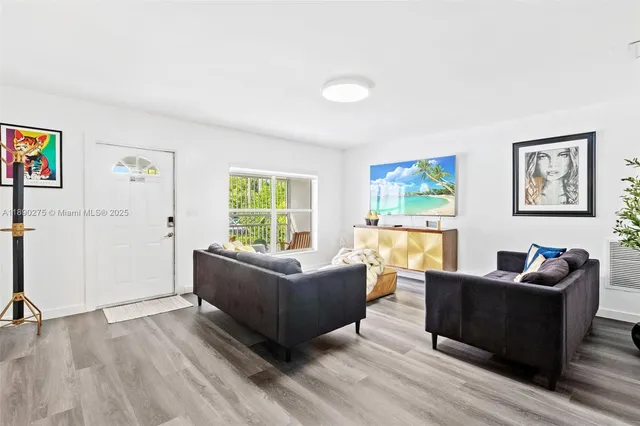a living room with furniture and a window