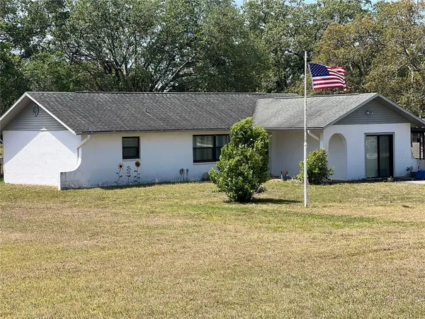 a house view with a garden space