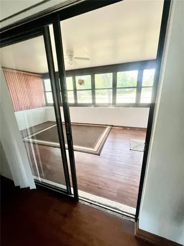 a view of a living room and a balcony