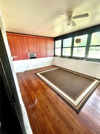 a view of a living room with a large window