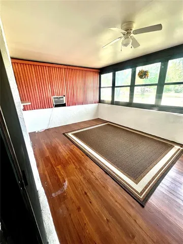 a view of a living room with a large window