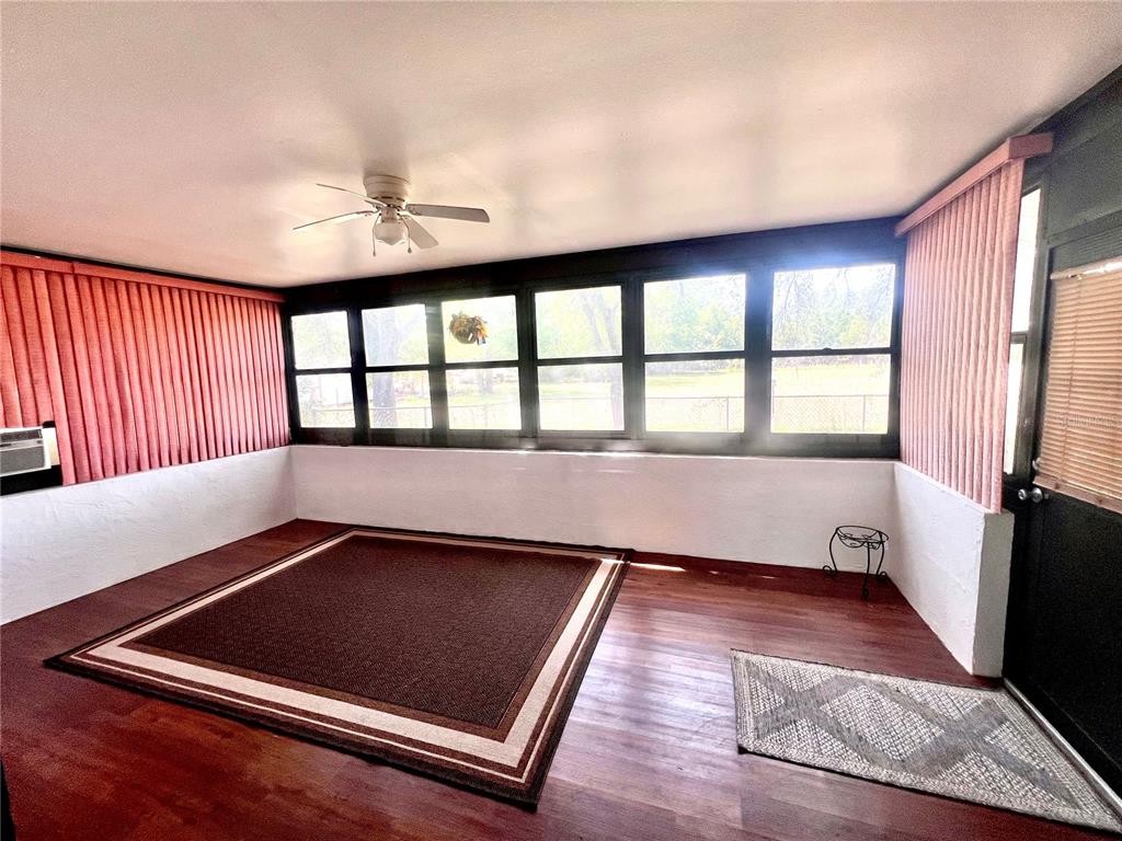 13020 Sun Road Brooksville, FL 34613 - Photo 19 of 33 a view of a living room with a large window