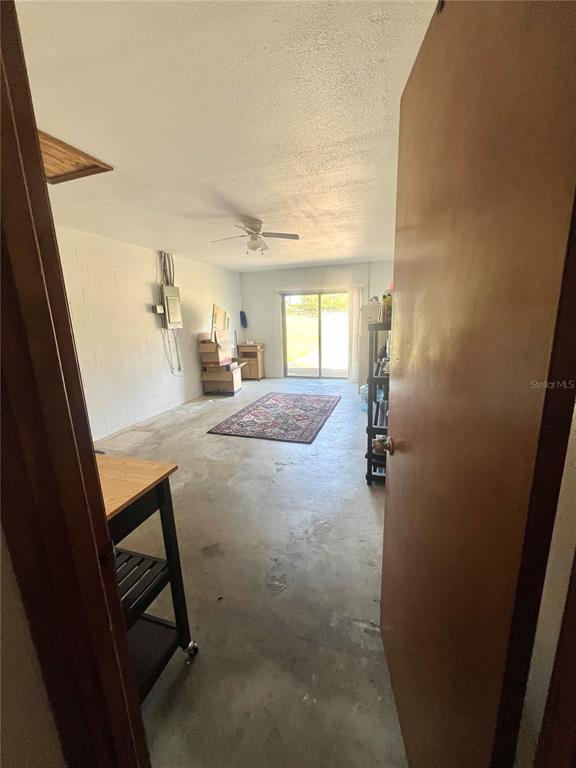 13020 Sun Road Brooksville, FL 34613 - Photo 23 of 33 a view of hallway with a table and chairs