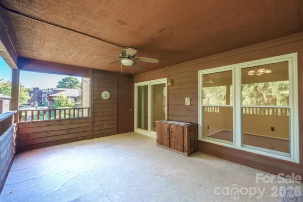 a view of an entryway with wooden floor and windows