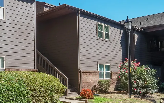 a view of a house with a small yard