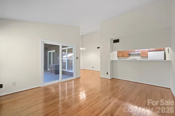 a view of a kitchen with wooden floor