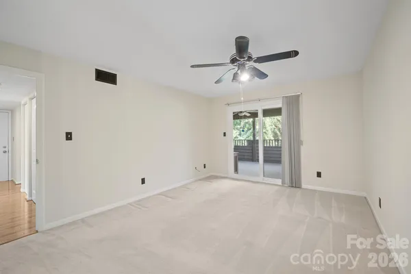 a view of an empty room with a window