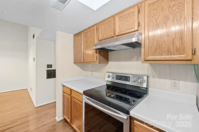 a kitchen with a stove and a microwave