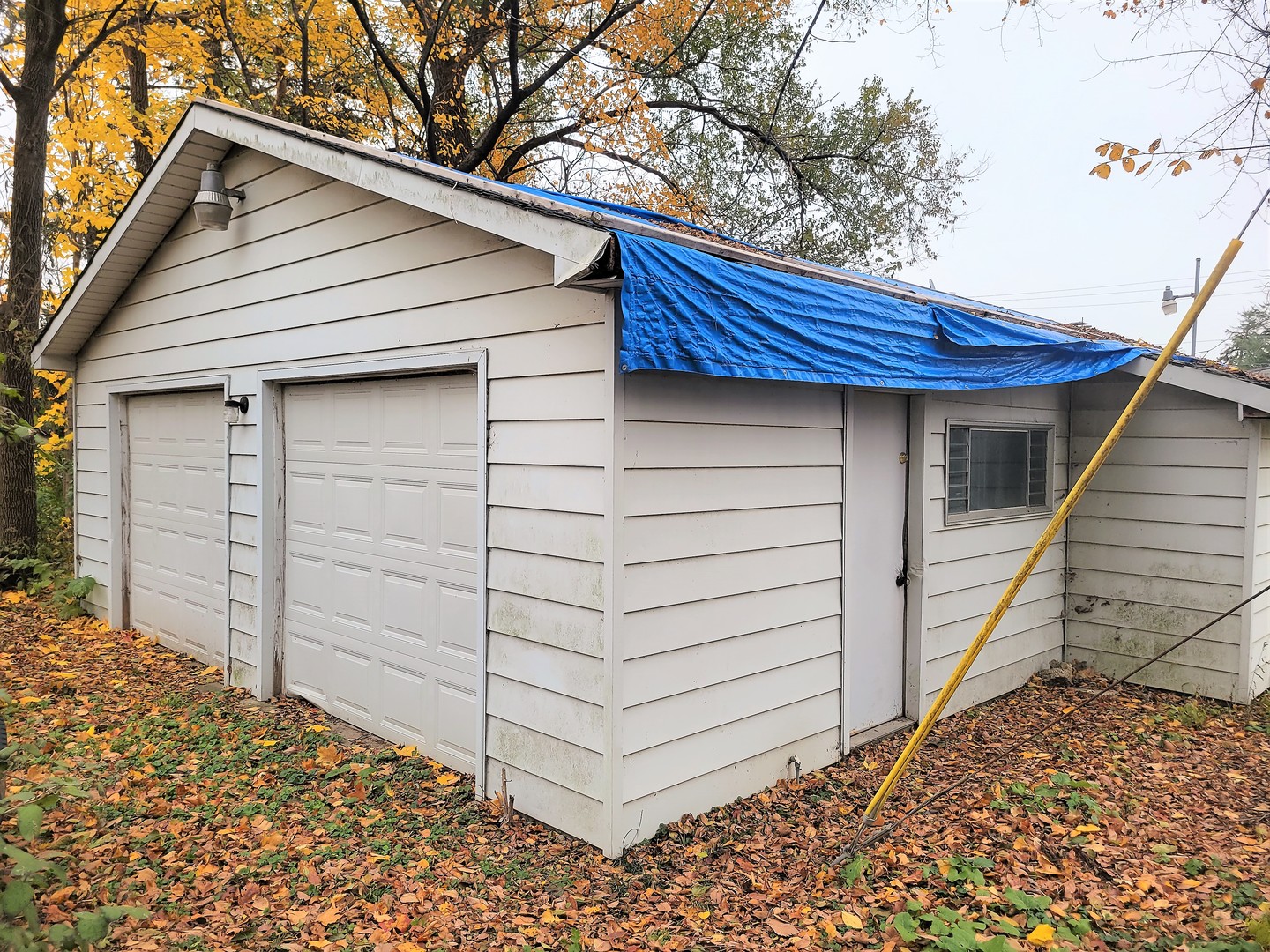 2576 Plainfield Road Joliet, IL 60435 - Photo 3 of 13 a view of a small house with wooden fence