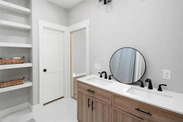 a bathroom with a sink and a mirror