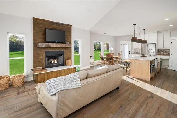 a living room with furniture fireplace and a television