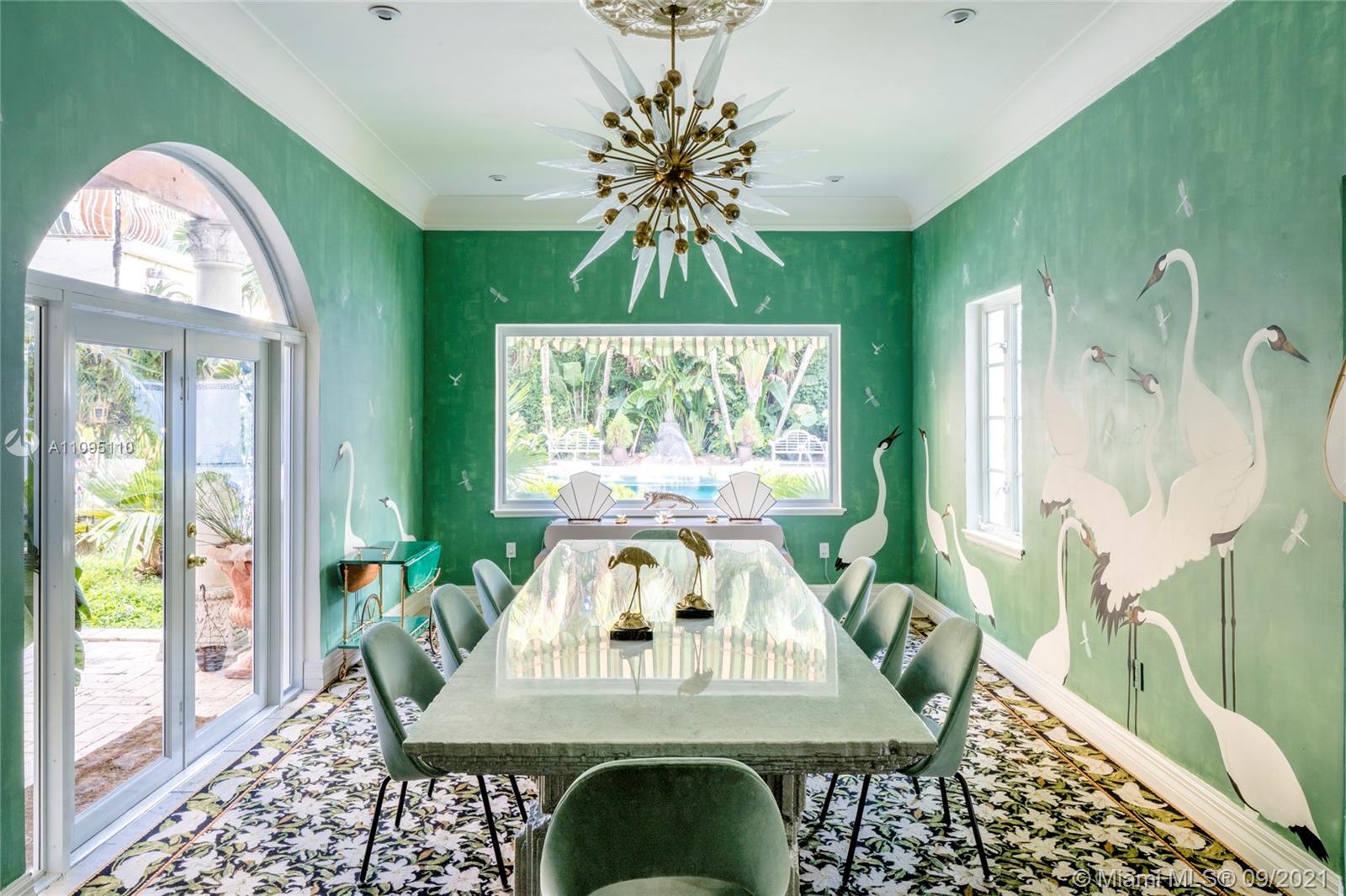 5454 Pine Tree Drive Miami Beach, FL 33140 - Photo 11 of 33 a view of a dining room with furniture window and outside view