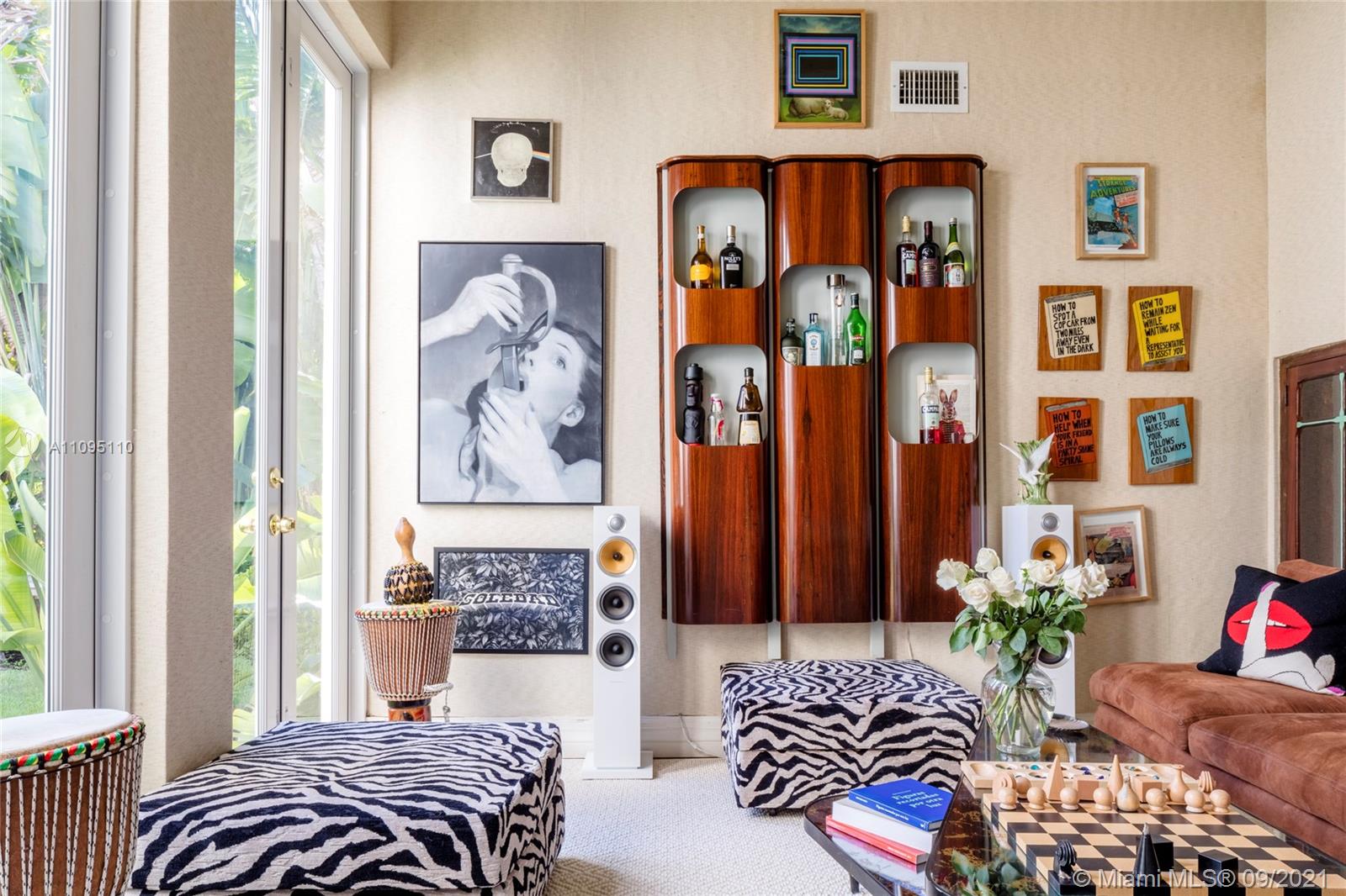 5454 Pine Tree Drive Miami Beach, FL 33140 - Photo 13 of 33 a bedroom with furniture and a window