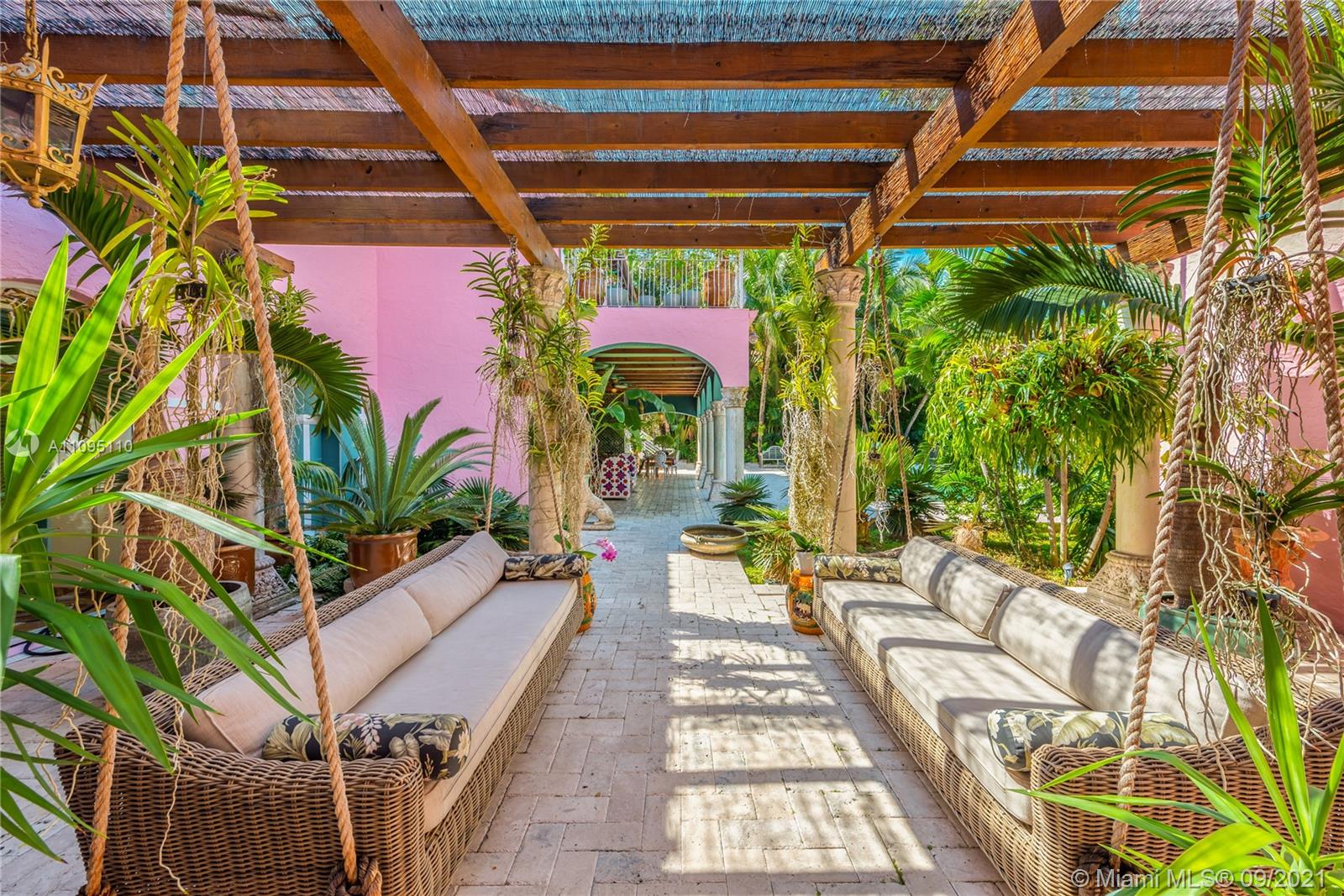 5454 Pine Tree Drive Miami Beach, FL 33140 - Photo 17 of 33 a building outdoor space with patio furniture