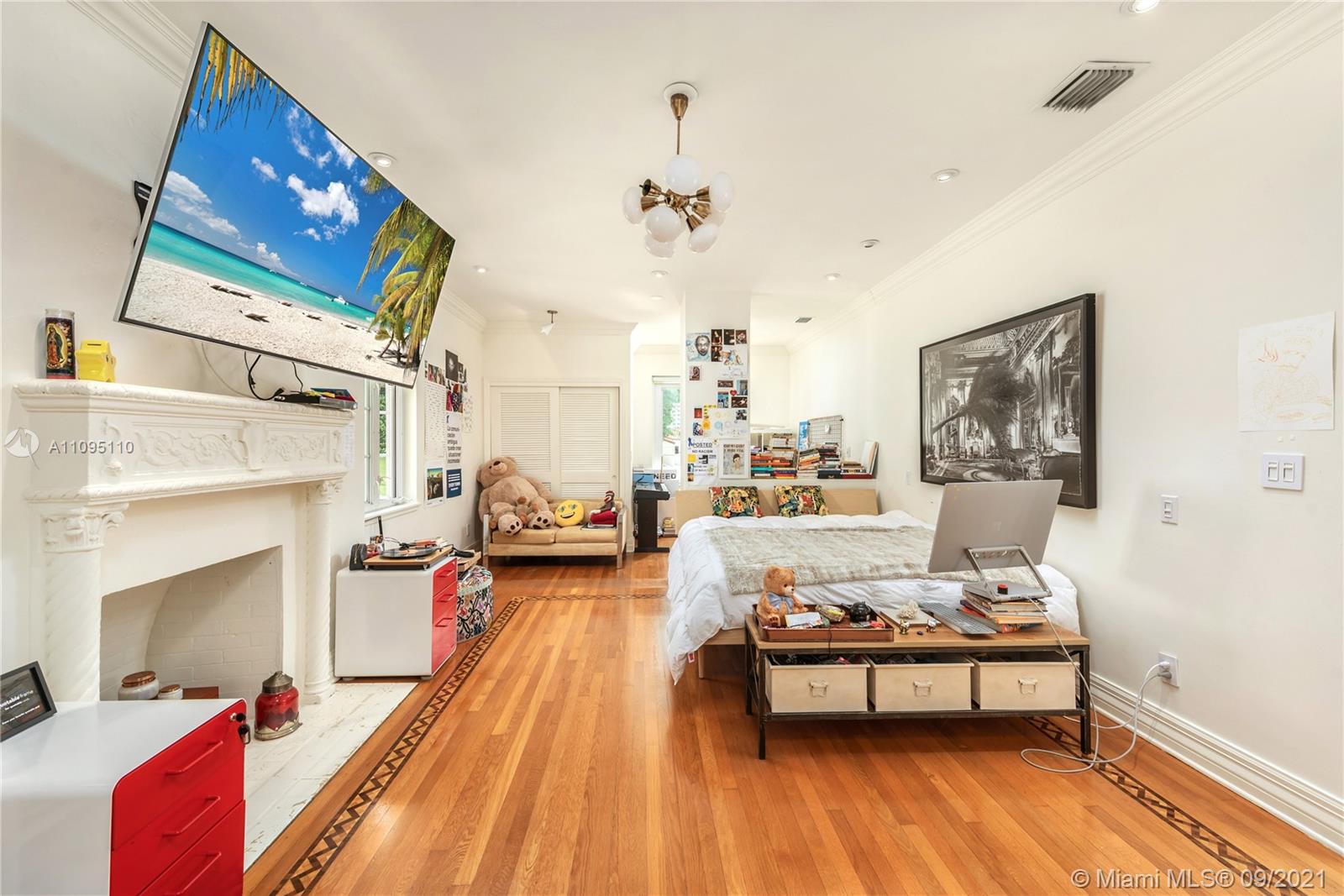 5454 Pine Tree Drive Miami Beach, FL 33140 - Photo 21 of 33 a living room with furniture and a fireplace