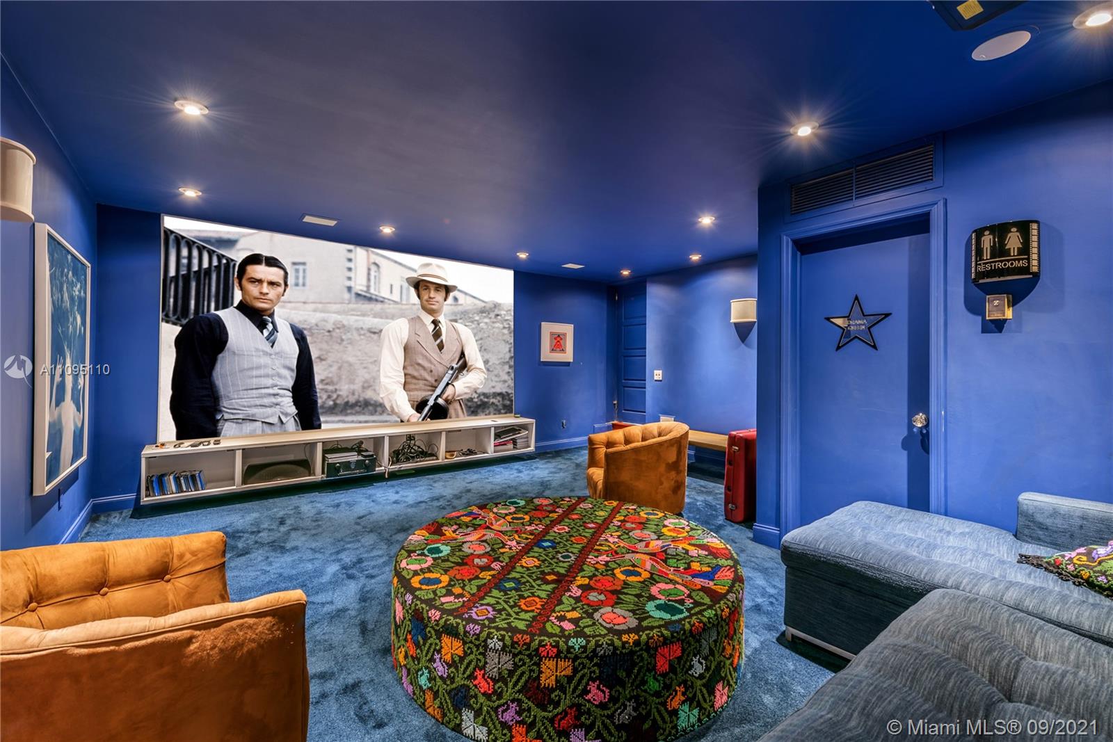 5454 Pine Tree Drive Miami Beach, FL 33140 - Photo 26 of 33 a bedroom with furniture and a couch