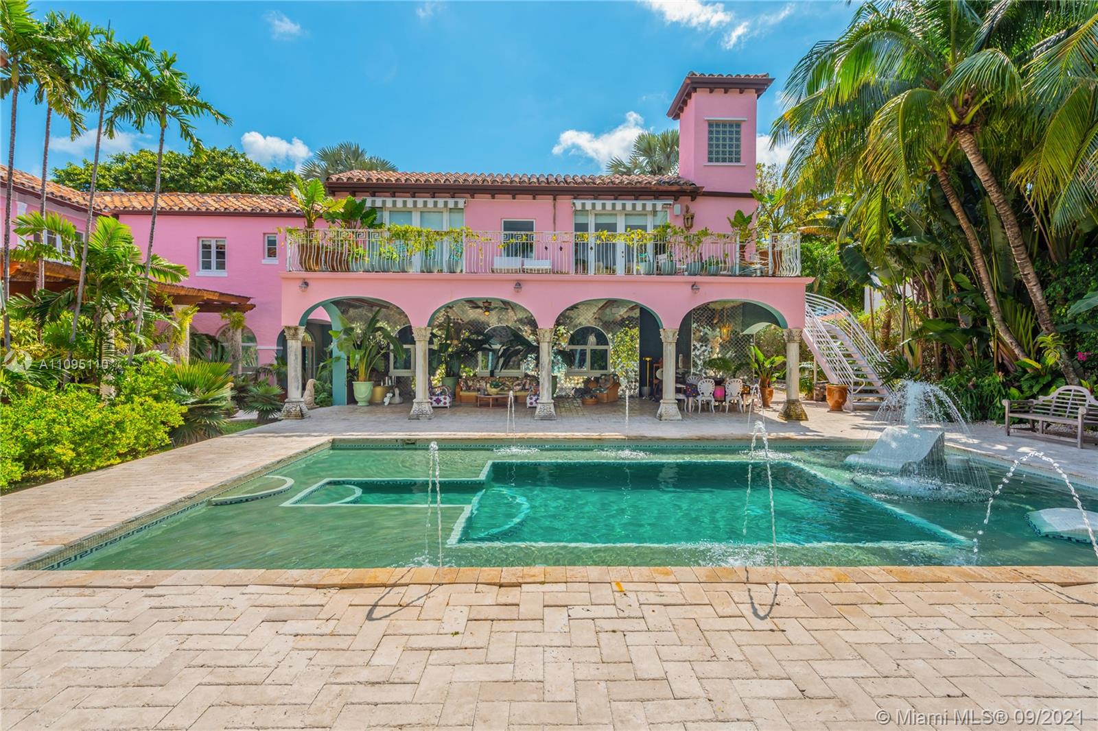 5454 Pine Tree Drive Miami Beach, FL 33140 - Photo 28 of 33 a view of building with a garden