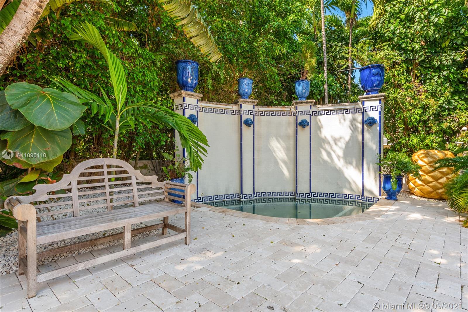5454 Pine Tree Drive Miami Beach, FL 33140 - Photo 29 of 33 a view of a chairs setting on the deck in front of a house