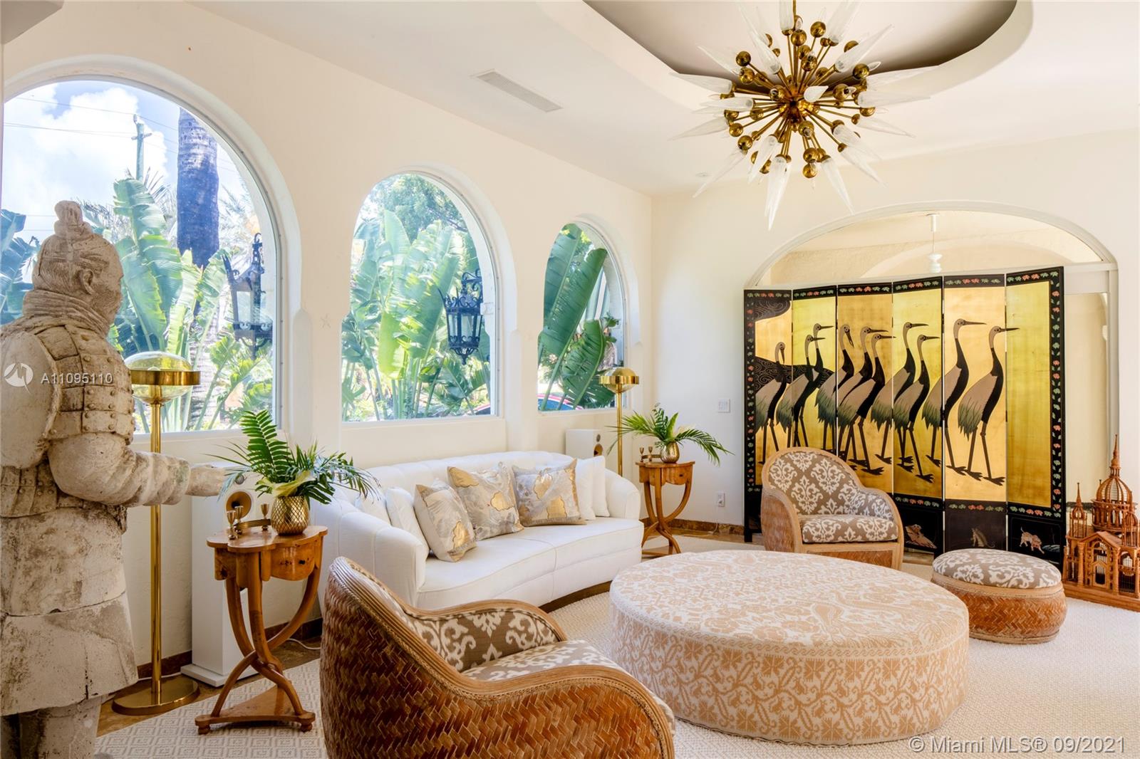 5454 Pine Tree Drive Miami Beach, FL 33140 - Photo 4 of 33 a living room with furniture and a large window