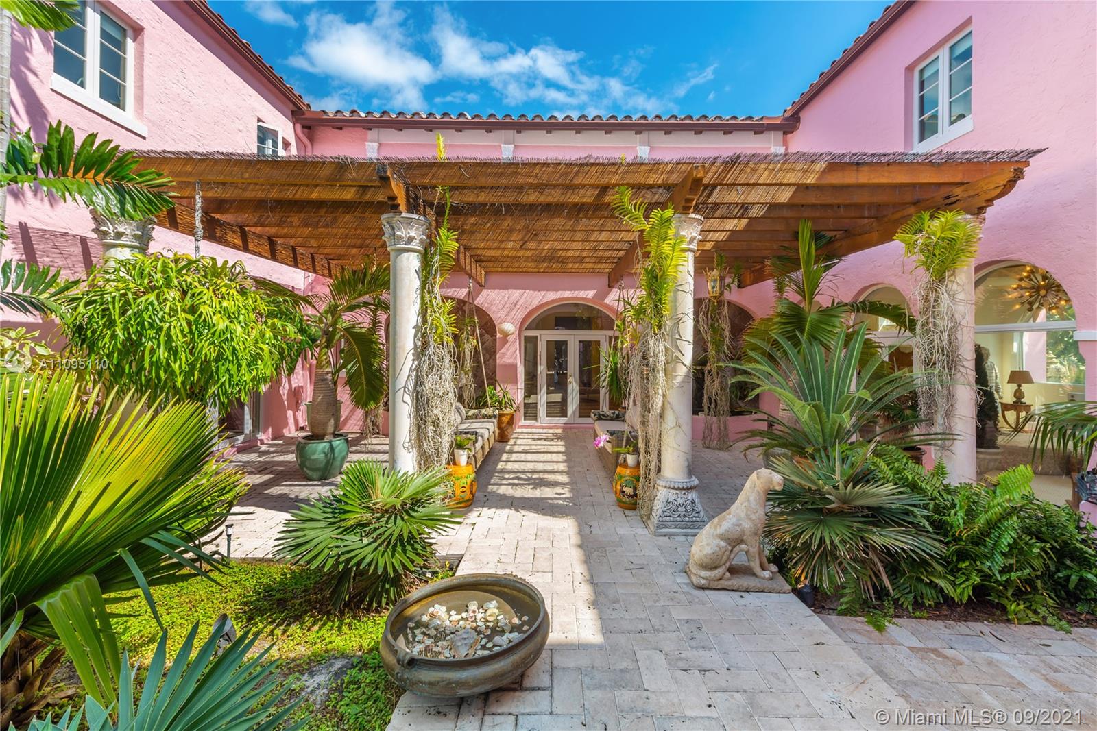 5454 Pine Tree Drive Miami Beach, FL 33140 - Photo 33 of 33 a view of a chairs and table in a patio